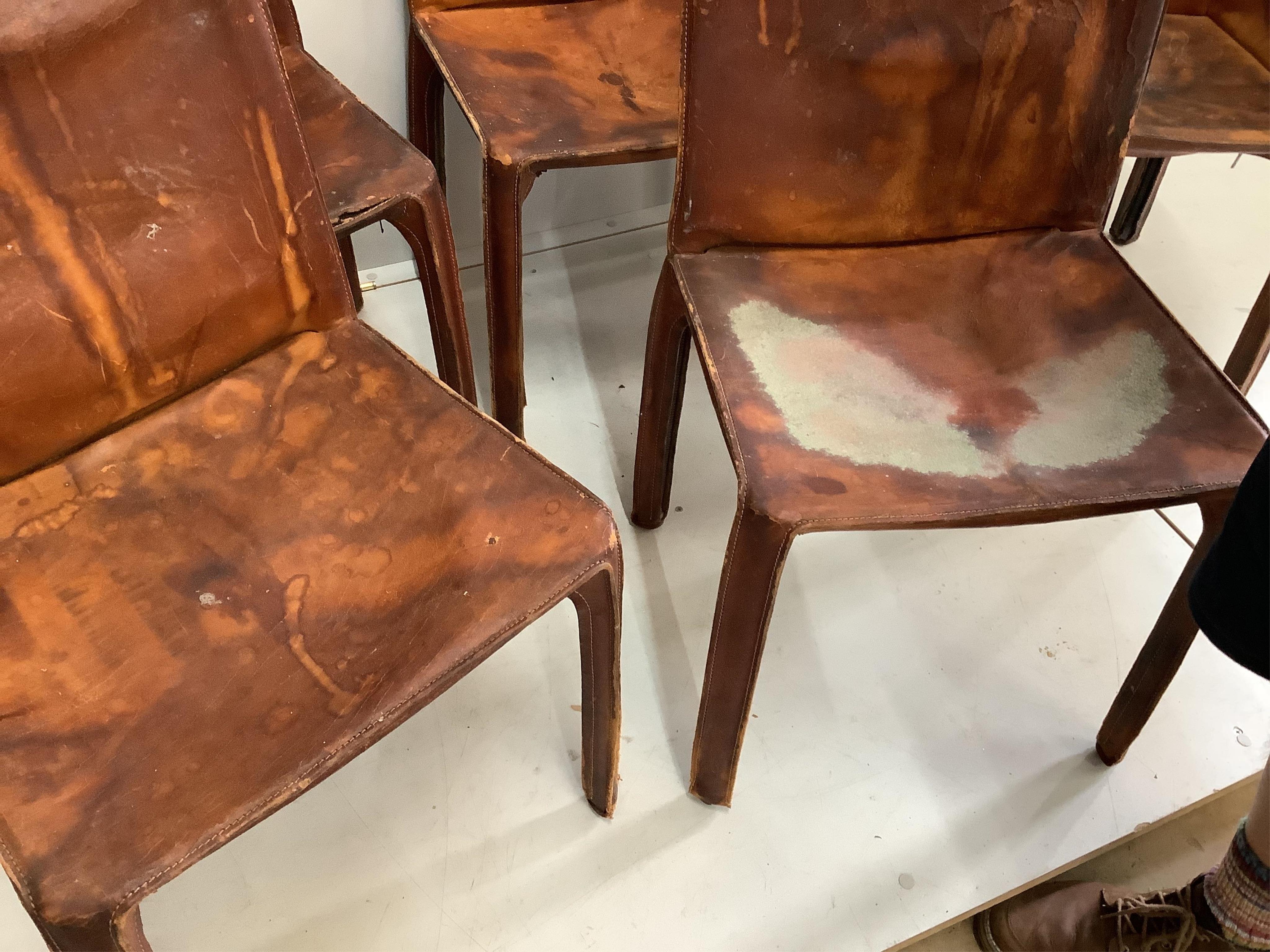 Mario Bellini, a set of six cognac leather lounge chairs, two with arms, larger width 60cm, depth 45cm, height 80cm. Condition - poor to fair